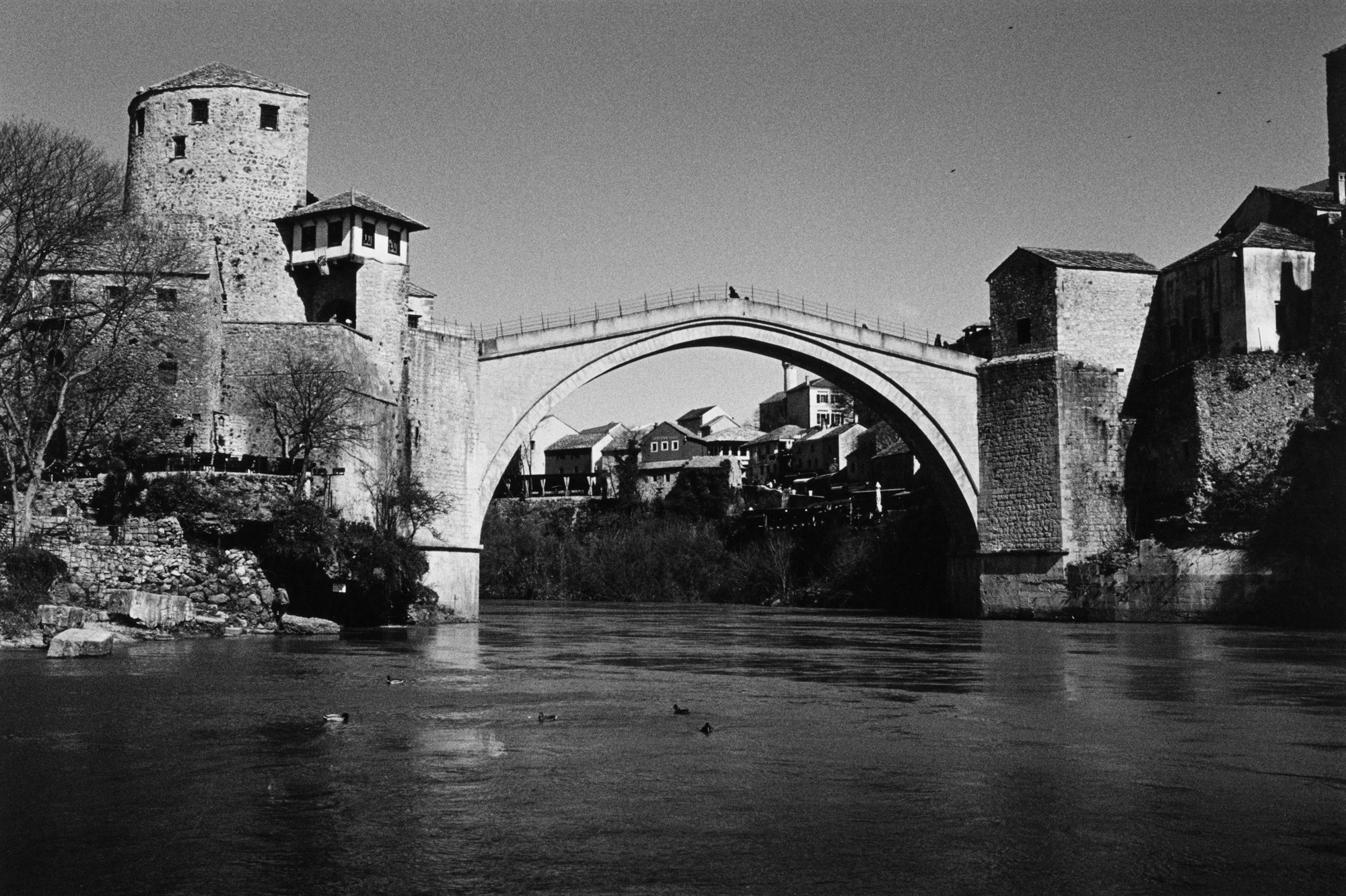 An old stone arched bridge over a river