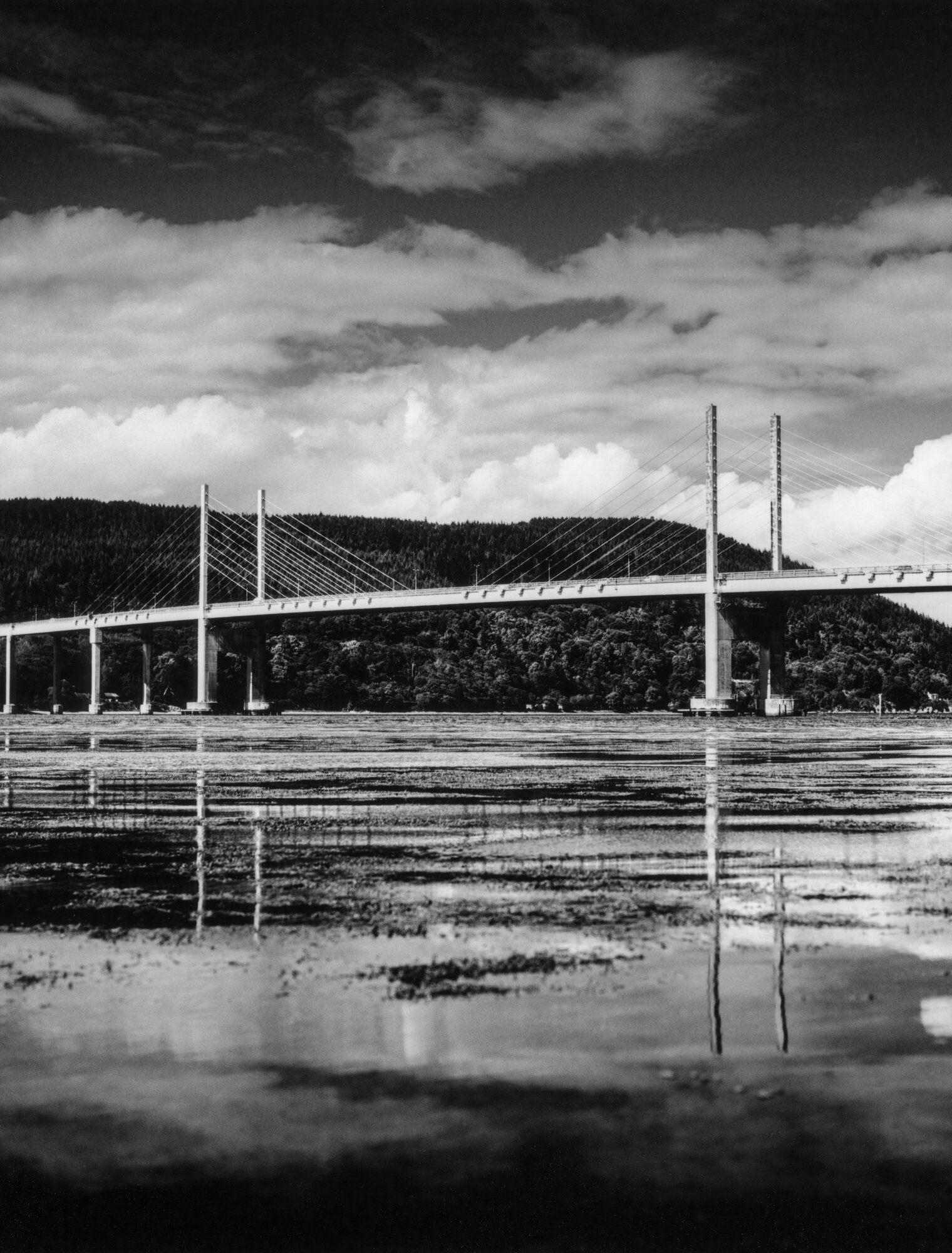 The Kessock Bridge reflected in the wet sands at low tide