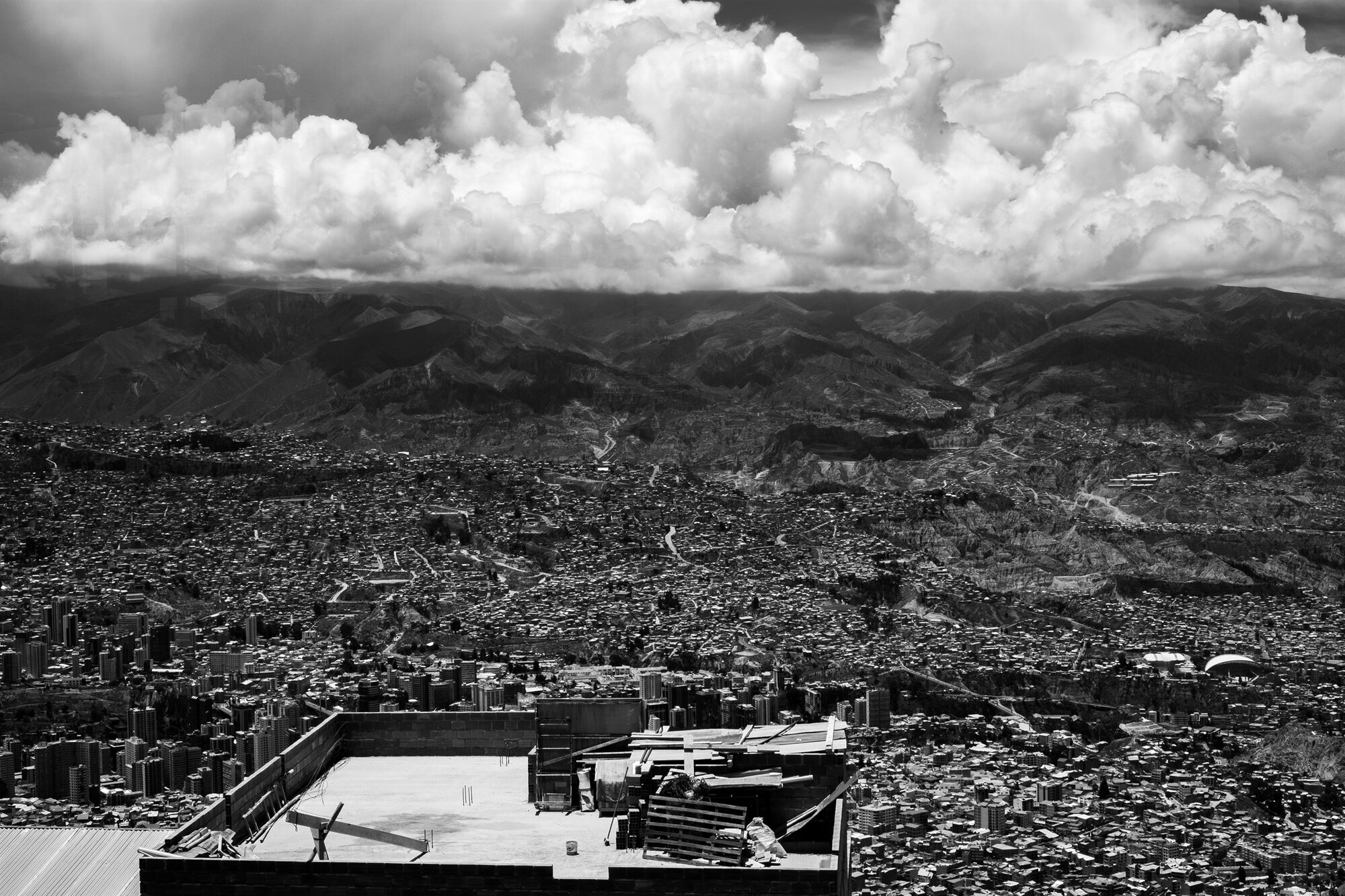 La Paz sprawling up the hillsides under heaped cloud