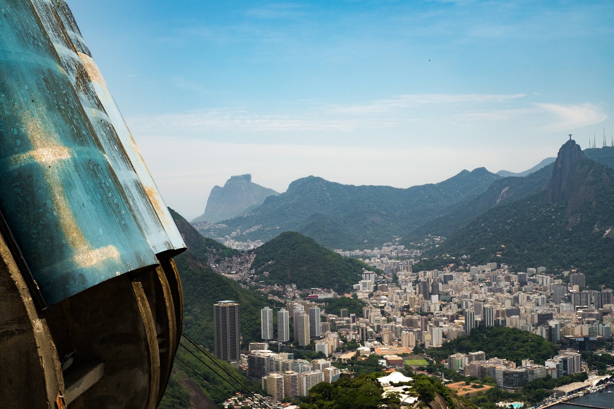 Rio and its mountains seen past a window frame