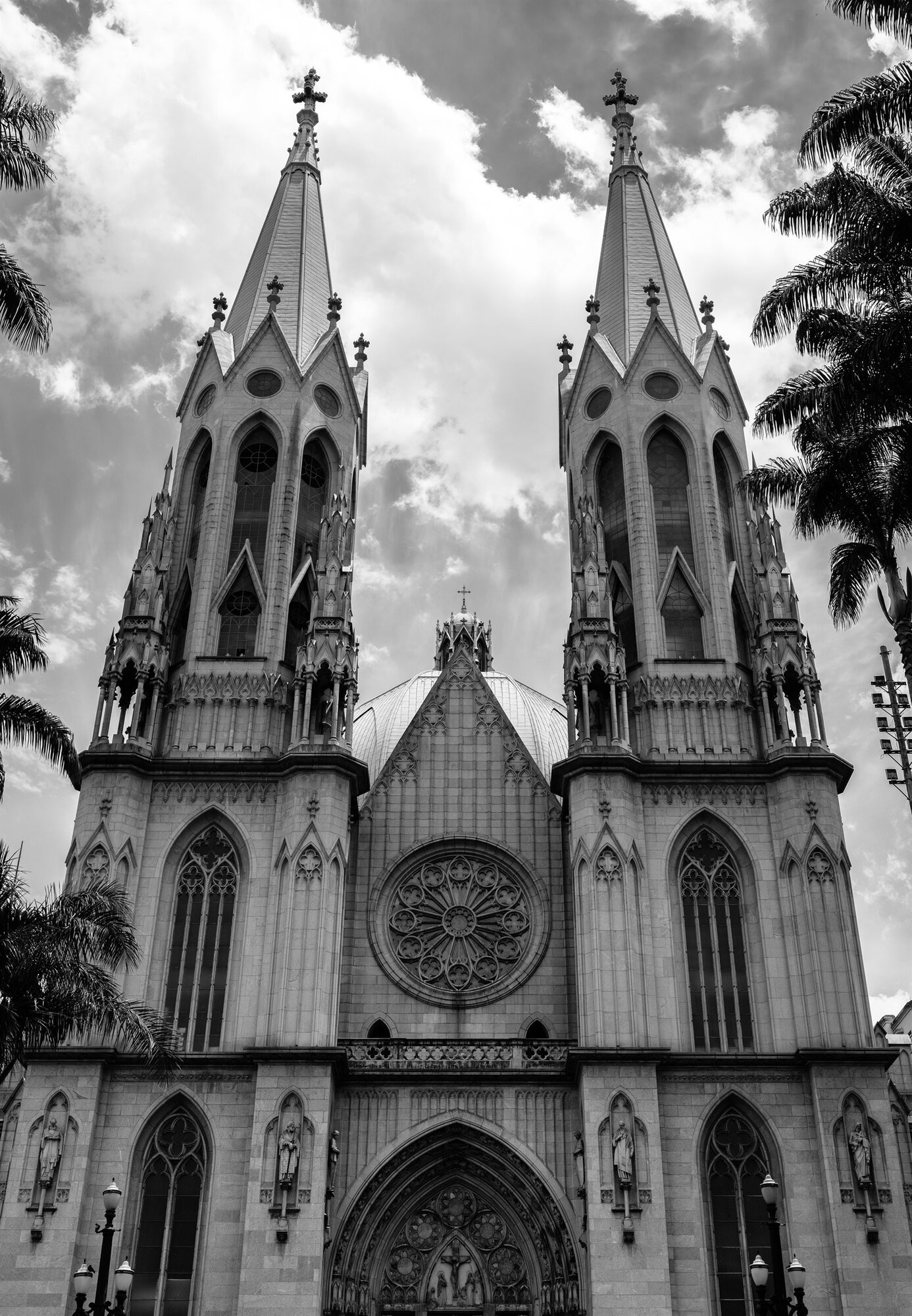 The twin spires of a cathedral against the clouds