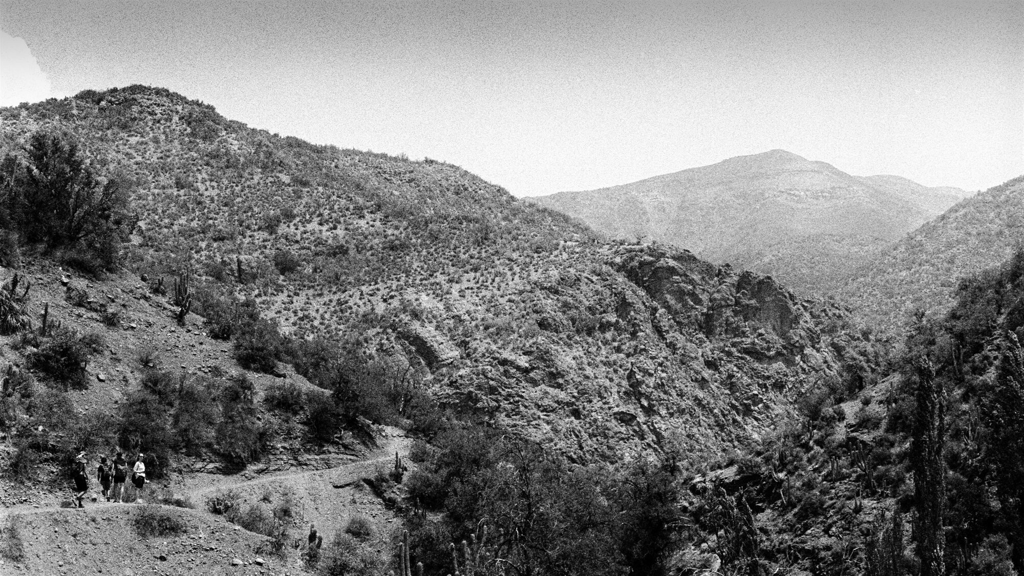A mountain valley with a path running along the slope