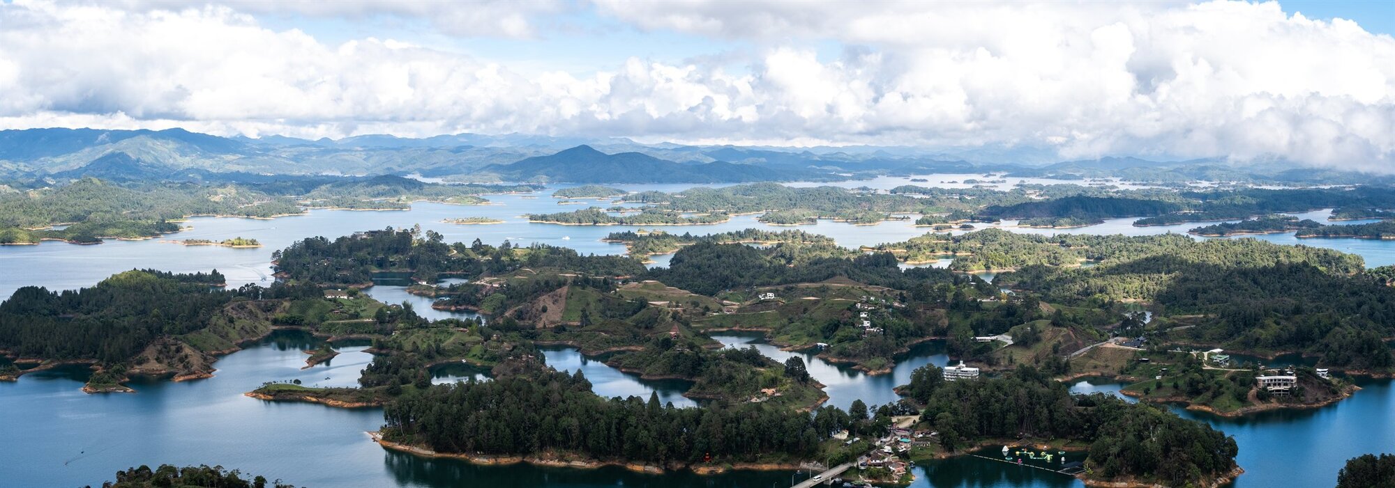 Winding lakes and wooded islands stretching to the hills