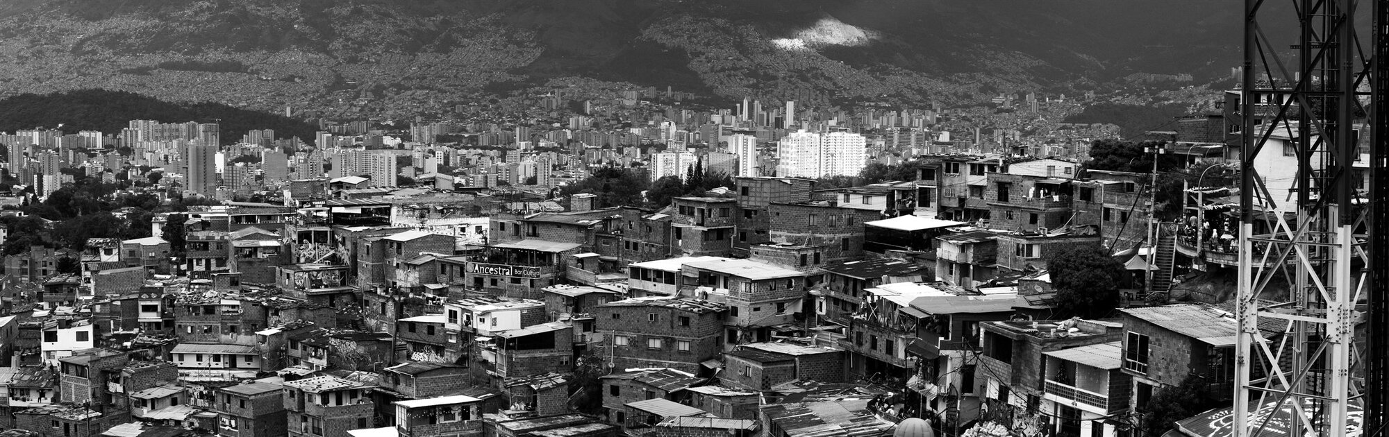 Rooftops of a hillside neighbourhood packed together